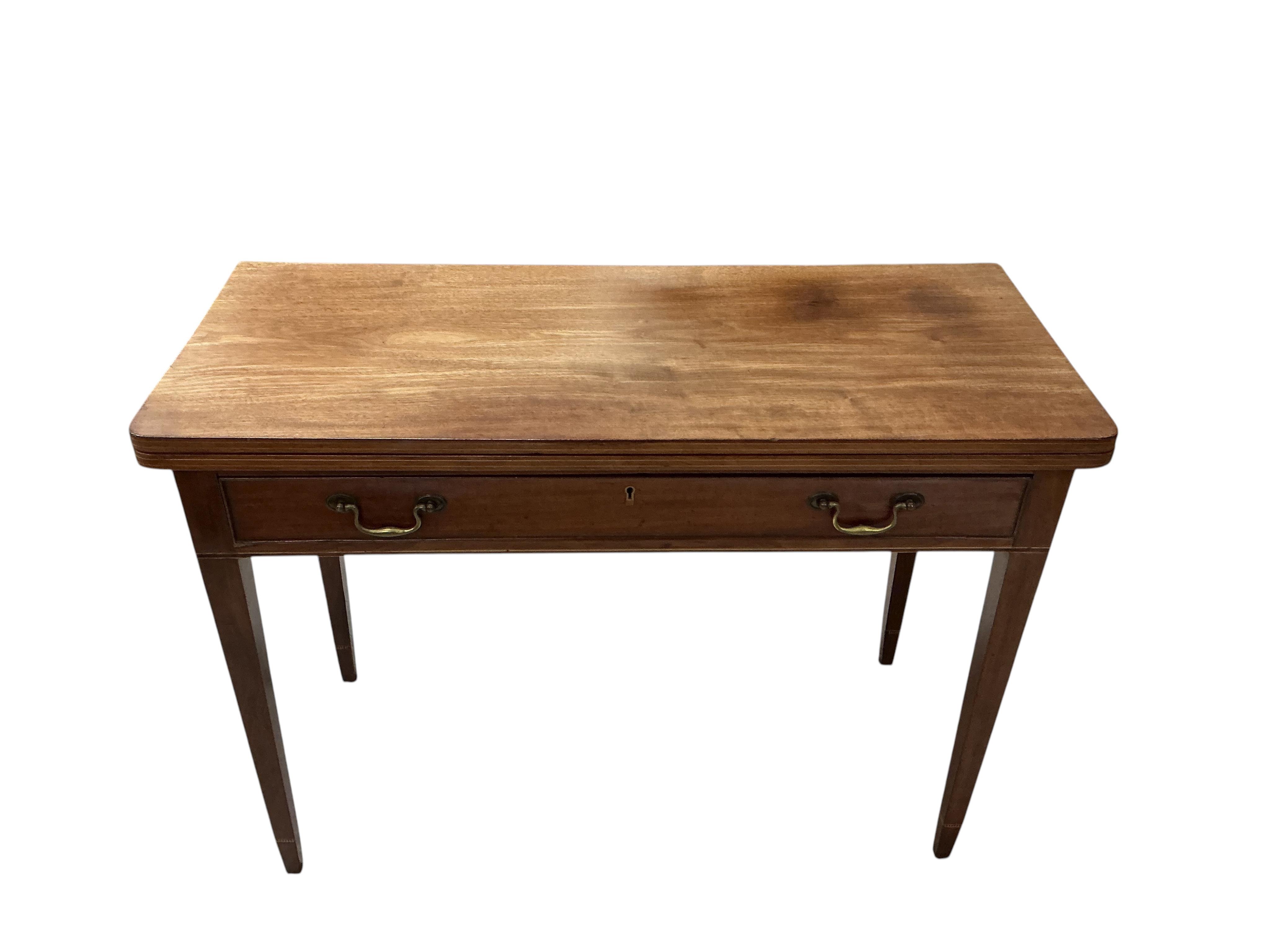 A George III rectangular mahogany folding tea table, width 101cm, depth 43cm, height 72cm